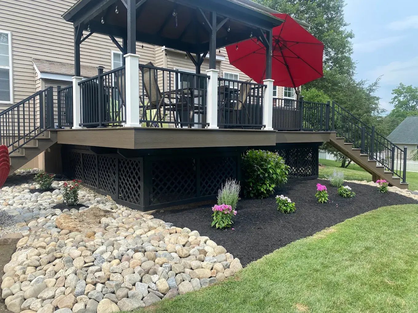 Exterior deck remodel with black railing and wood pergola in Bucks County Exterior deck remodel with black railing and wood pergola in Bucks County