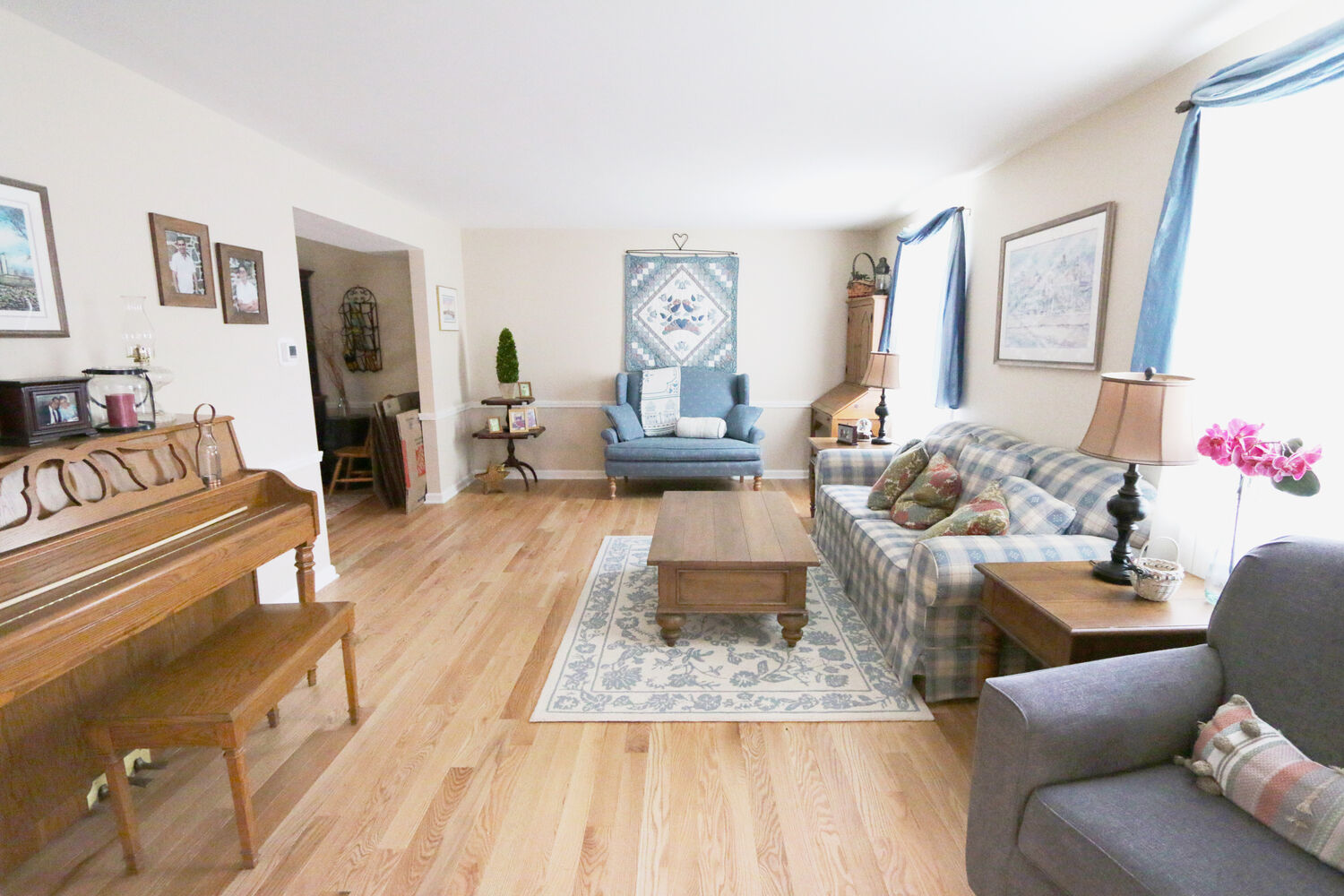 Complete living room restoration with updated flooring and furnishings in Perkasie, PA custom home by Metzler Construction