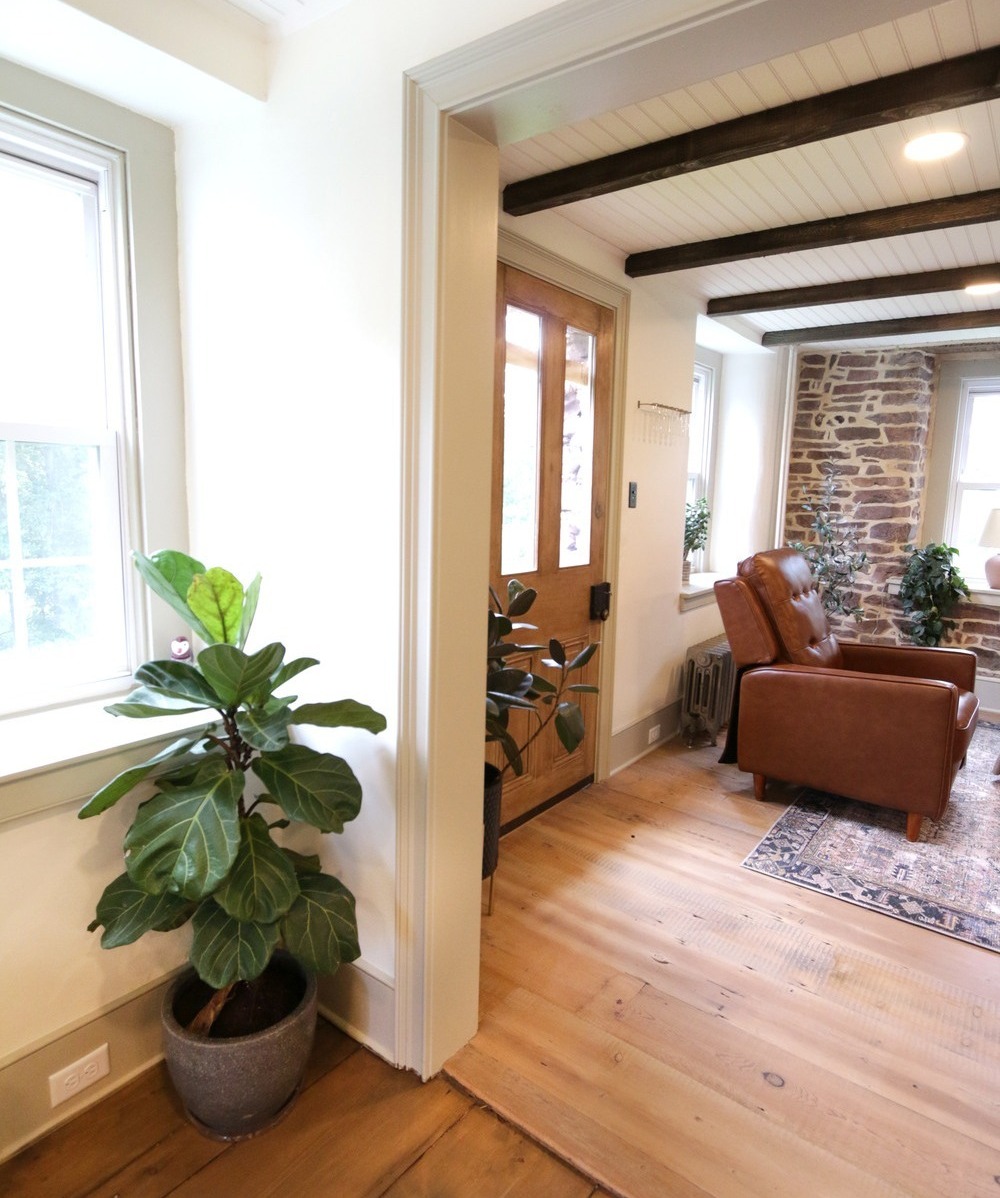 Home remodel with white trim, shiplap ceilings, and dark wood floors in Montgomery County-1