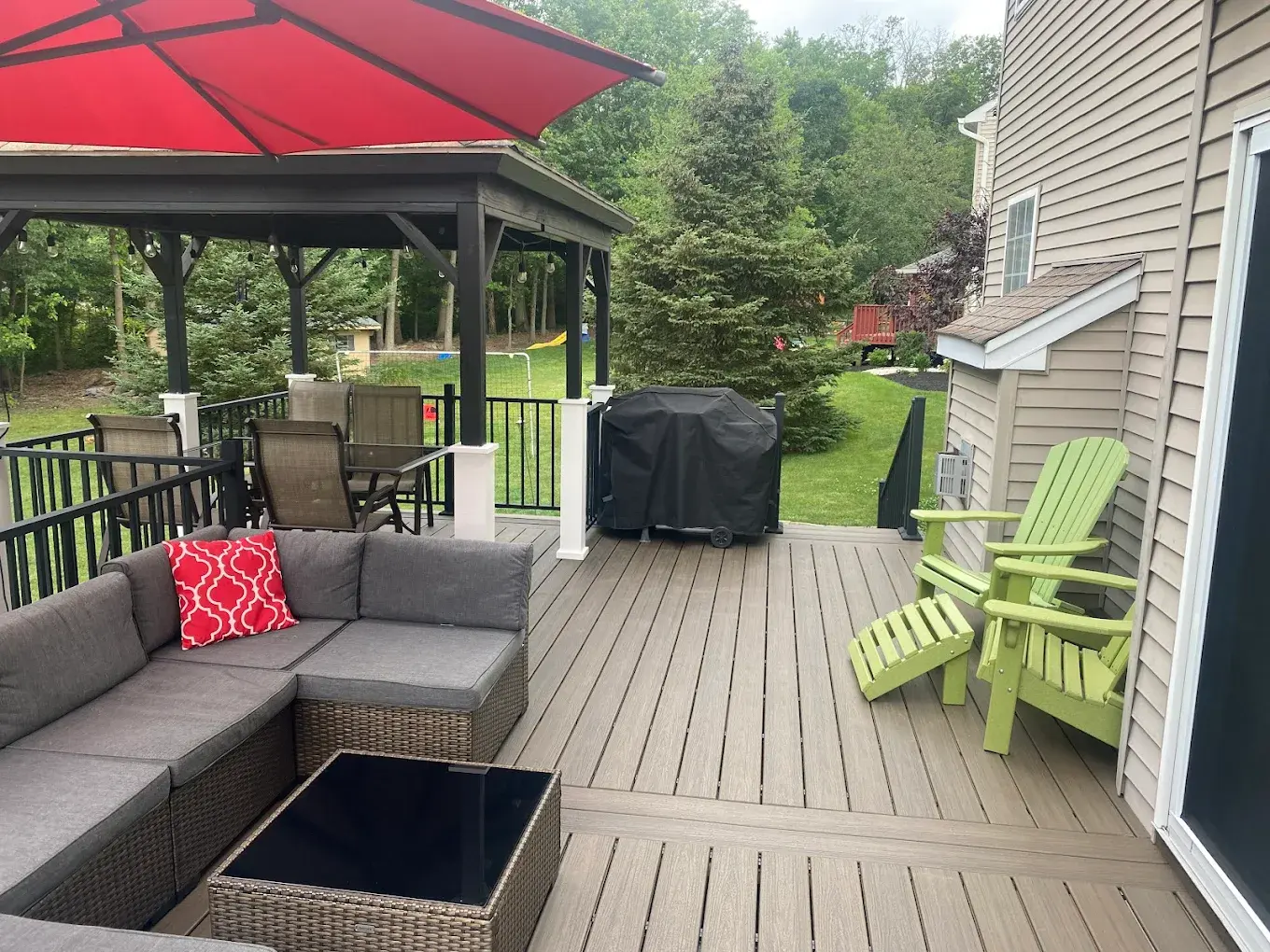 Composite deck with pergola and sitting area in Montgomery County