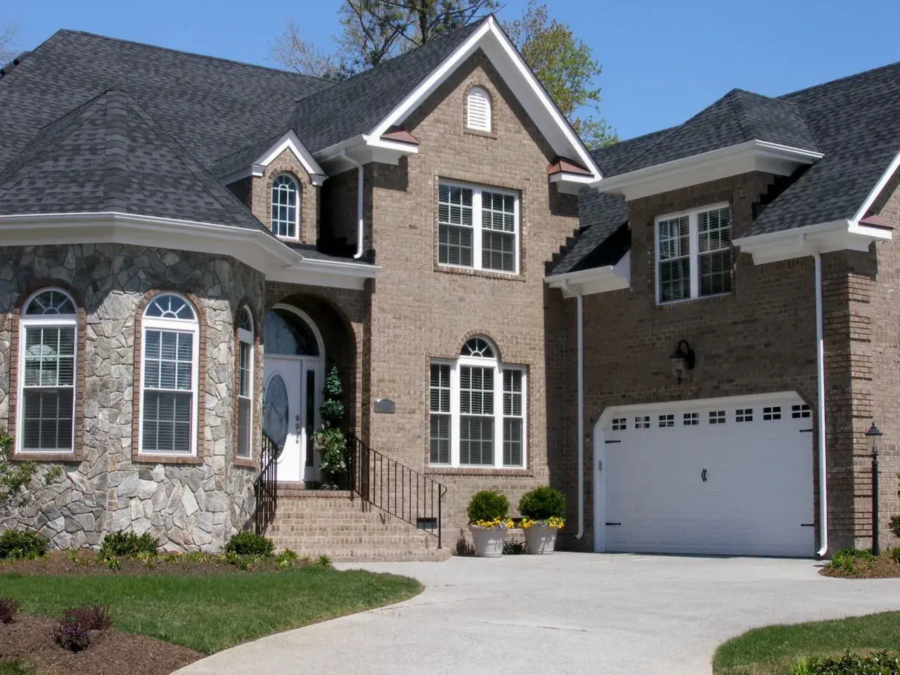 Exterior home remodel with brick and stone siding by Metzler Construction