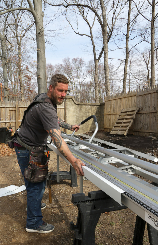 Metzler Construction carpenter works on home remodel