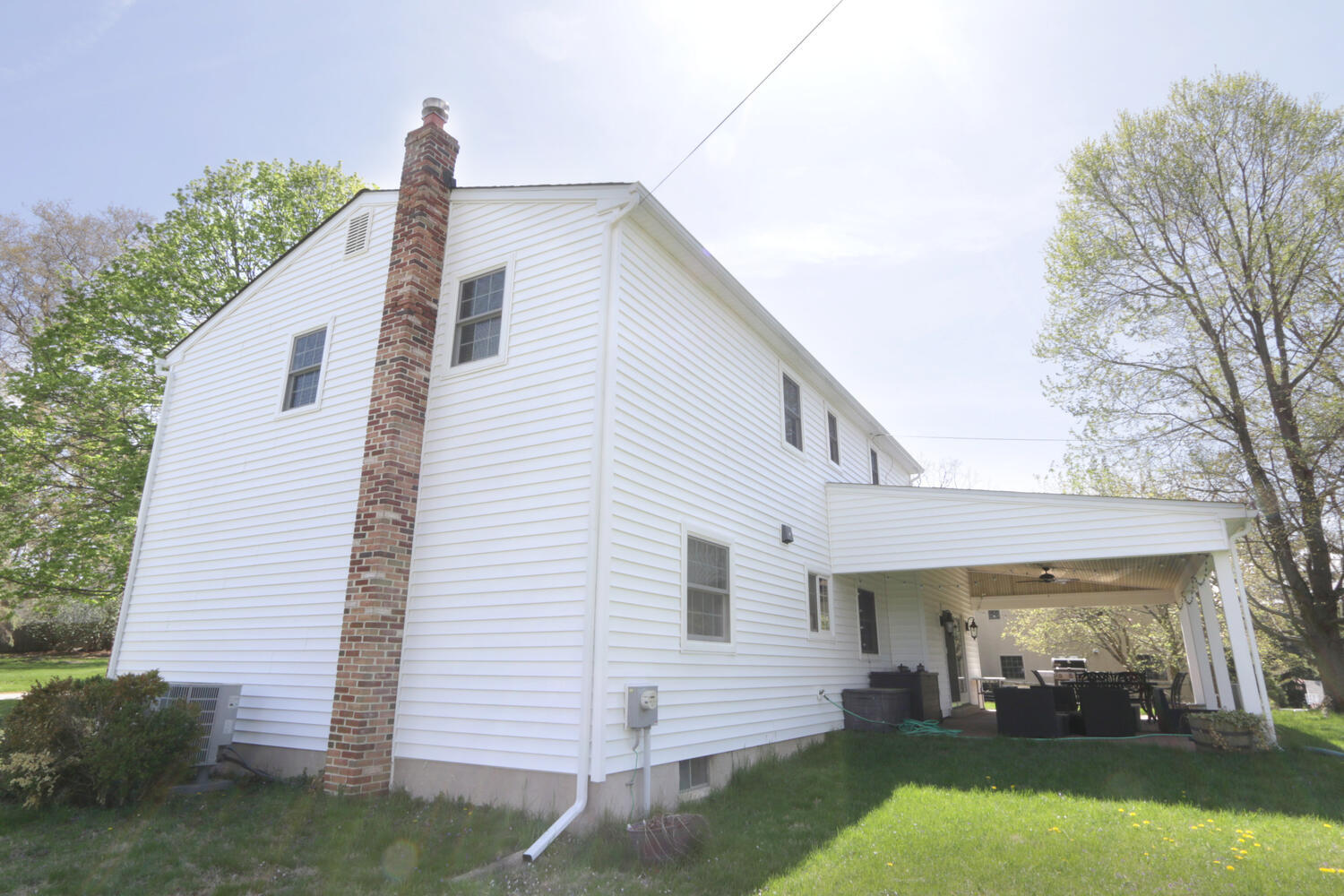 Back view of custom home in Perkasie, PA with completed storm damage repairs by Metzler Construction