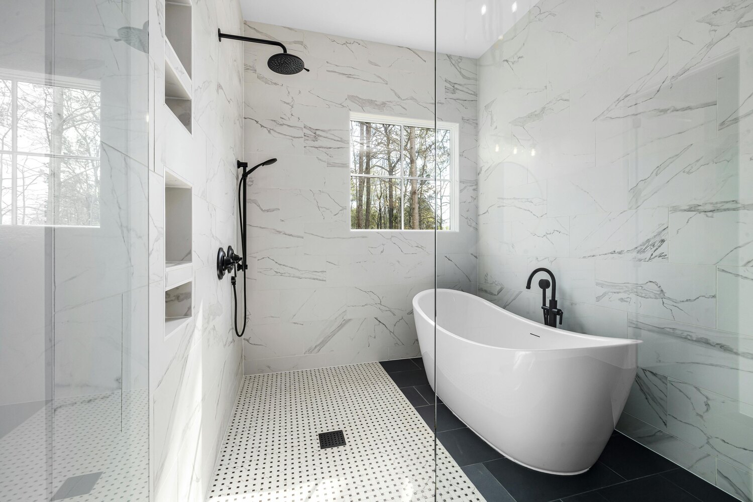 Modern wet room with soaking tub and full glass enclosure by Metzler Construction in Perkasie, PA - Stock Image